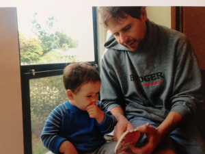 Father and son reading together.